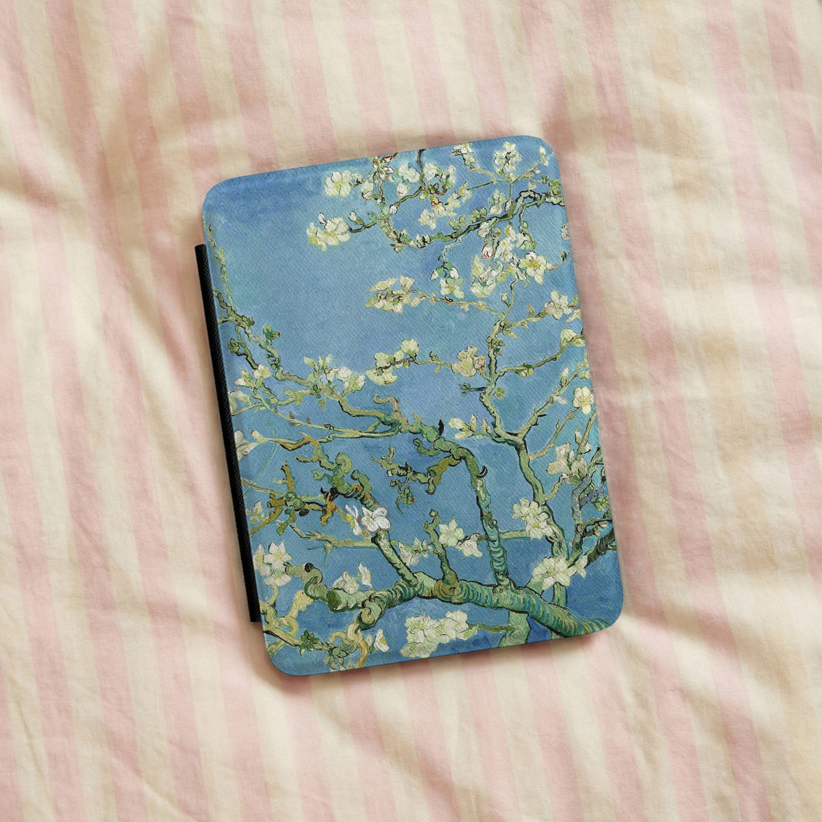 Almond Blossom Kindle case on a bed