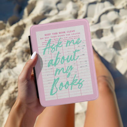 Ask Me About My Books Kindle case held open at the beach