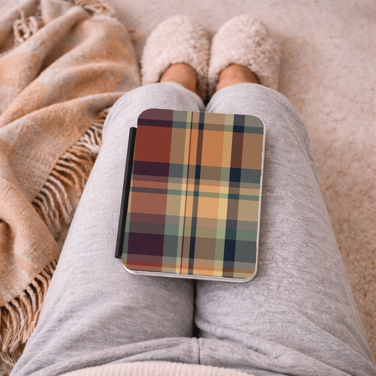 Autumn Plaid Kindle case on a lap with a cozy blanket