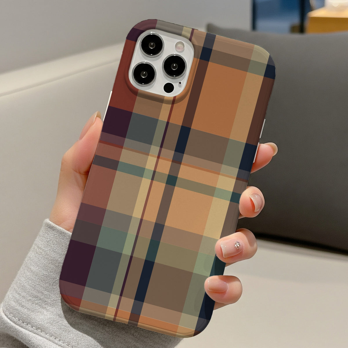 Autumn Plaid tough phone case held in one hand