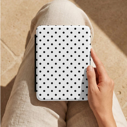 Black Polka Dot Kindle case on a lap in linen trousers