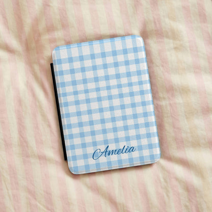 Blue gingham Kindle case on pink bed linen