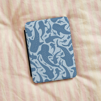 Blue whale shark Kindle case on striped bed linen