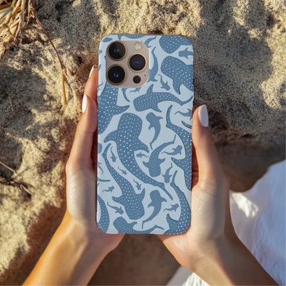 Hands holding a Blue Whale Shark tough phone case over sand