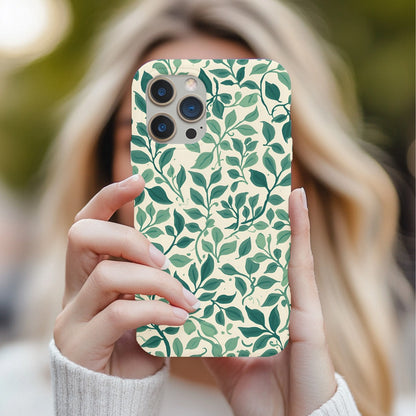 Woman holding a Botanical Leaf phone case in front of her face
