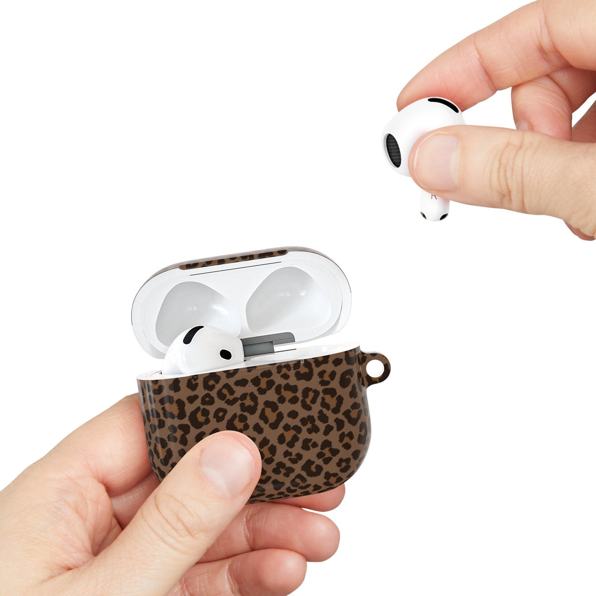Brown leopard print AirPods case held in hand while taking out an AirPod