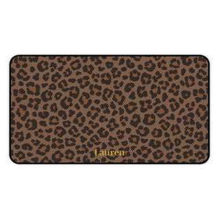 Brown leopard print desk mat laid flat with a name in gold script