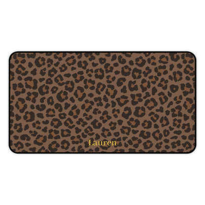 Brown leopard print desk mat laid flat with a name in gold script