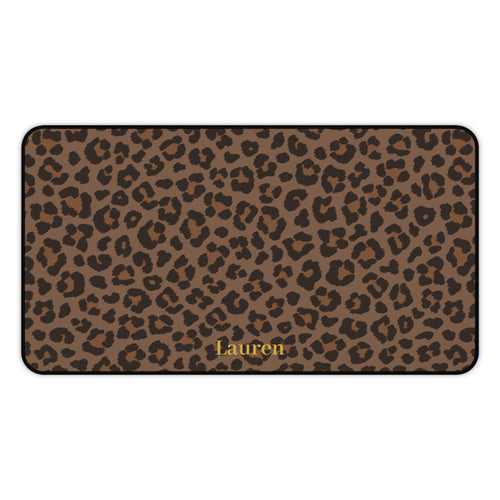 Brown leopard print desk mat laid flat with a name in gold script