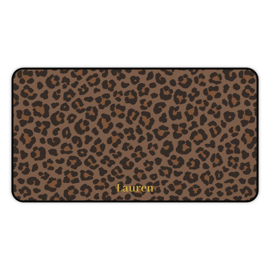 Brown leopard print desk mat laid flat with a name in gold script