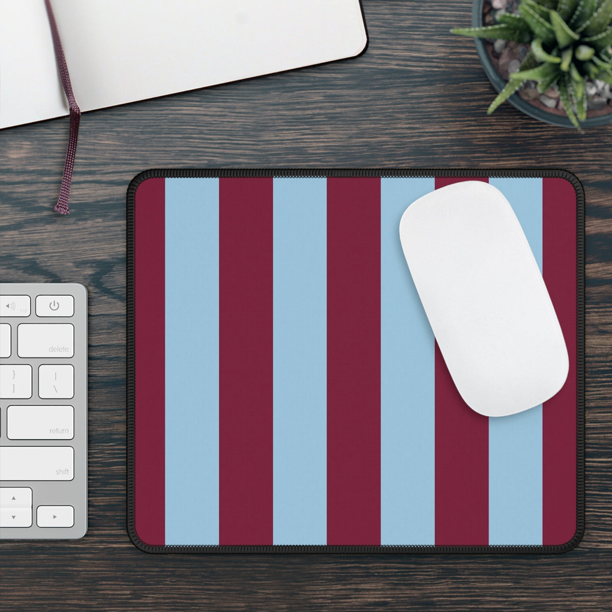 Burgundy cabana stripe mouse mat on a wooden desk beside a keyboard and mouse