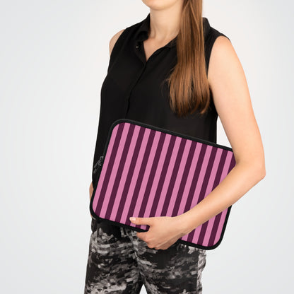 Woman carrying a Burgundy Pink Cabana Stripe laptop sleeve
