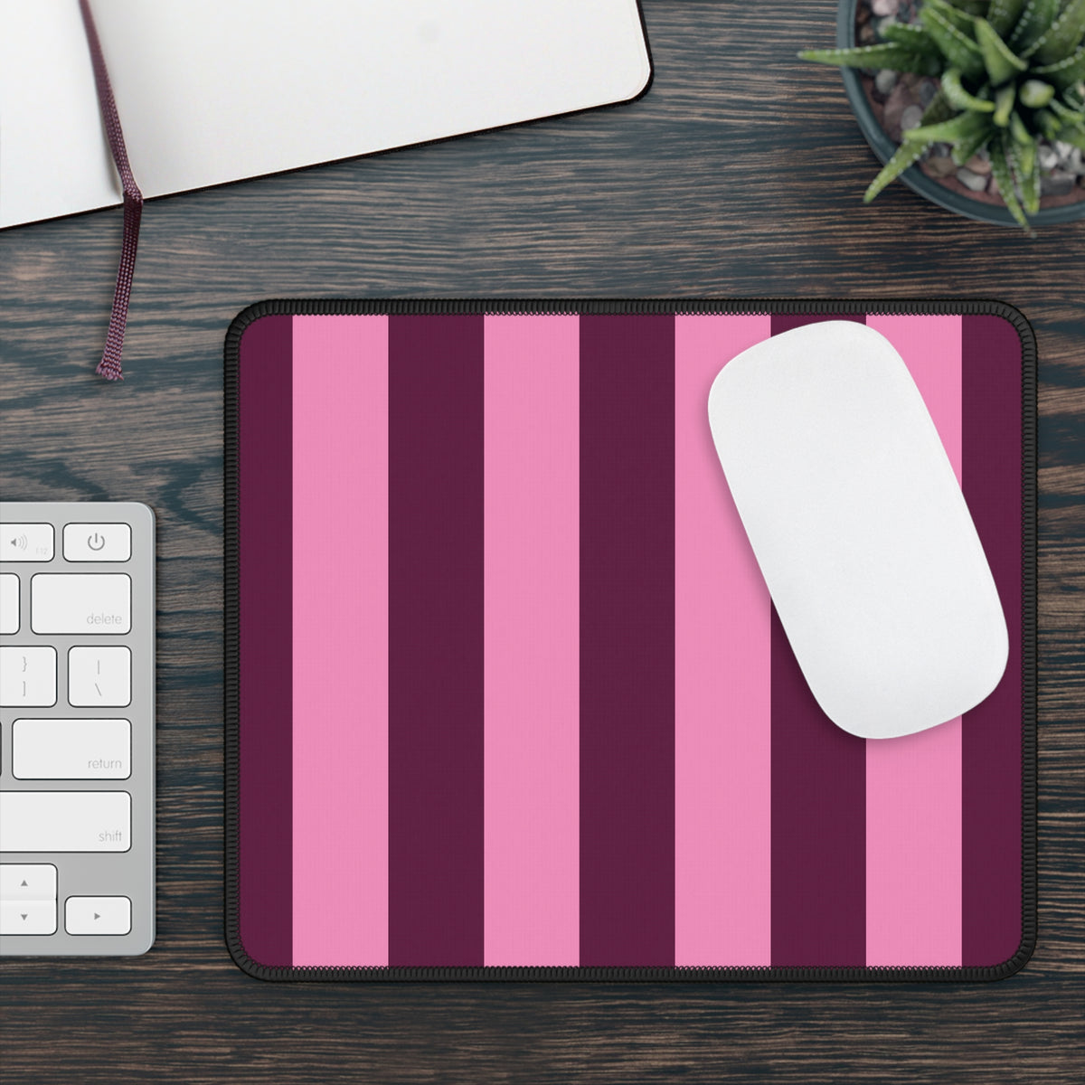 Burgundy Pink Cabana Stripe mouse mat on a wooden desk with a white mouse