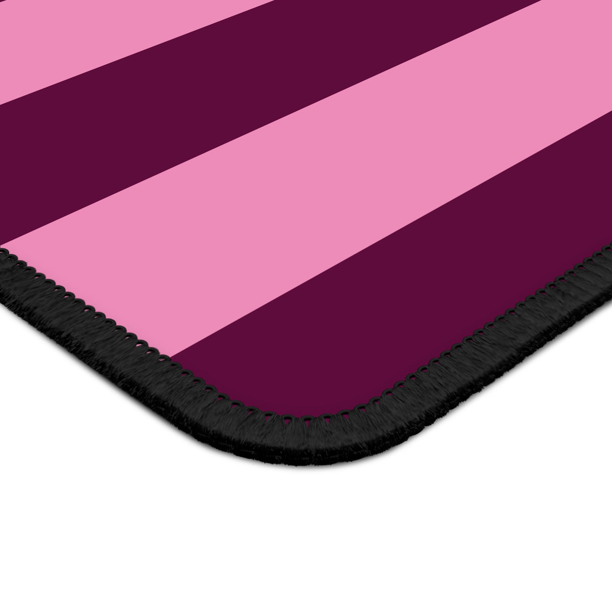 Close-up of the Burgundy Pink Cabana Stripe mouse mat stripes and stitched edge
