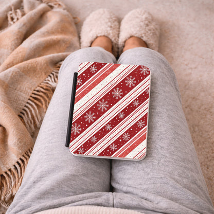 Candy Cane Snowflake Kindle case on the lap under a cosy blanket