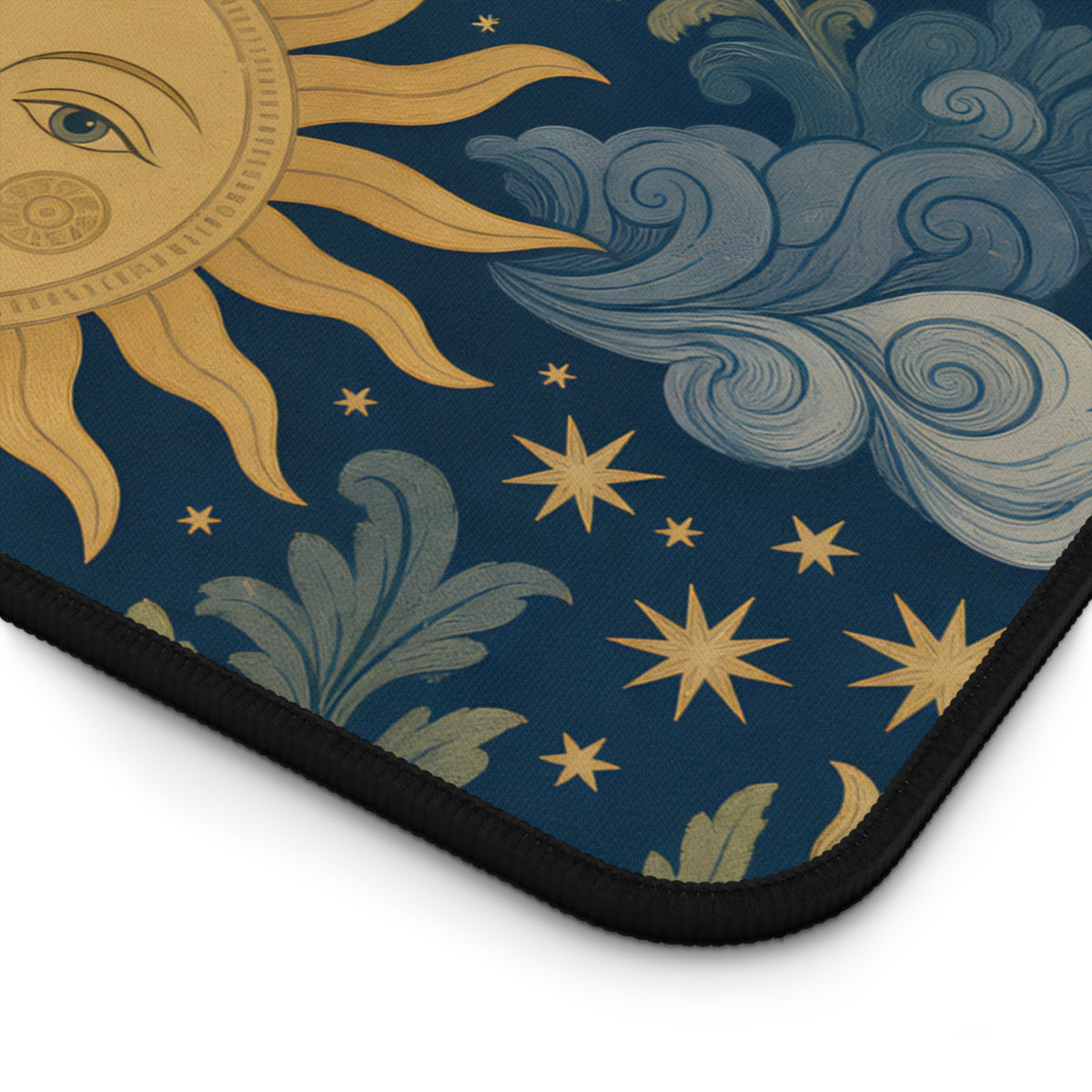 Close-up of the sun face and stitched edge of the Celestial Garden desk mat