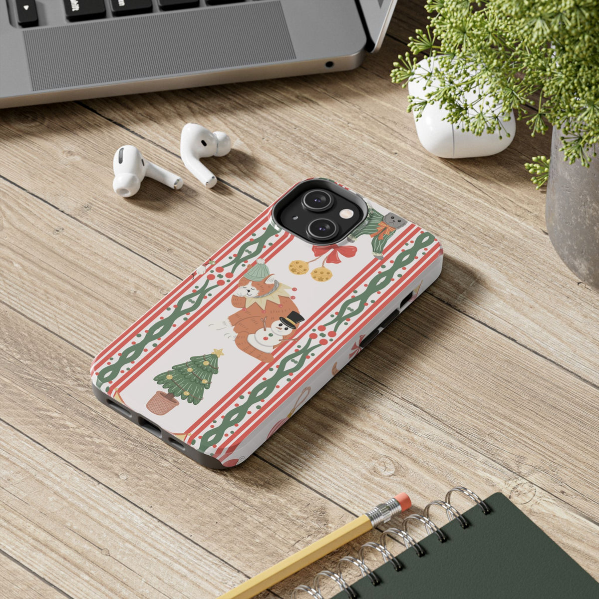 Christmas Cat tough phone case lying on a desk