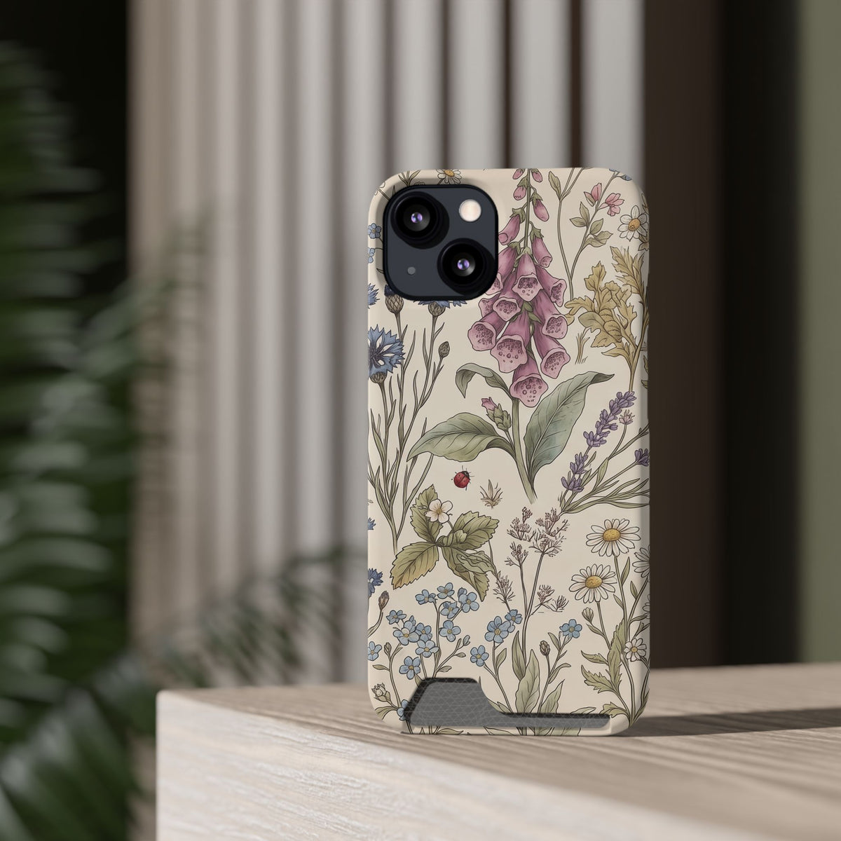 Cottage Meadow card holder phone case standing on a desk