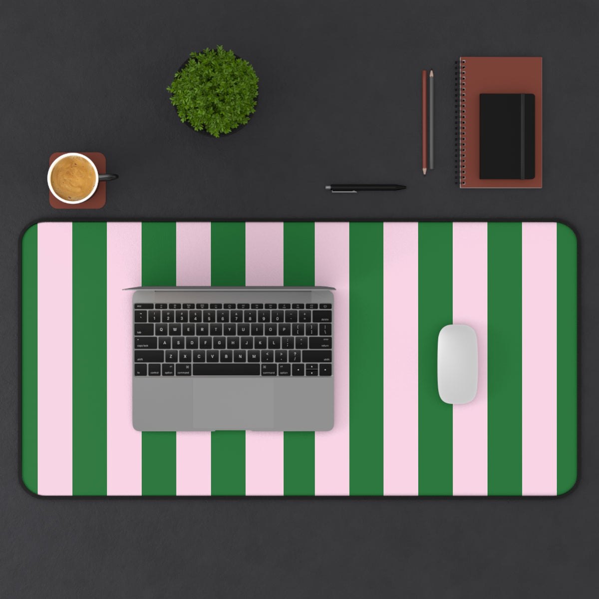 Green cabana stripe desk mat under a laptop, keyboard and mouse