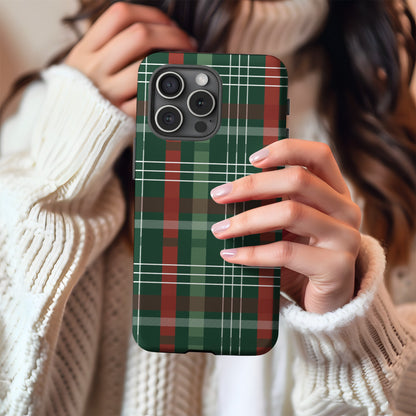 Green Christmas Plaid tough phone case held against a cosy winter sweater