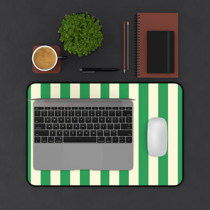 Green Cream Cabana Stripe desk mat on a dark desk with laptop, mouse and coffee