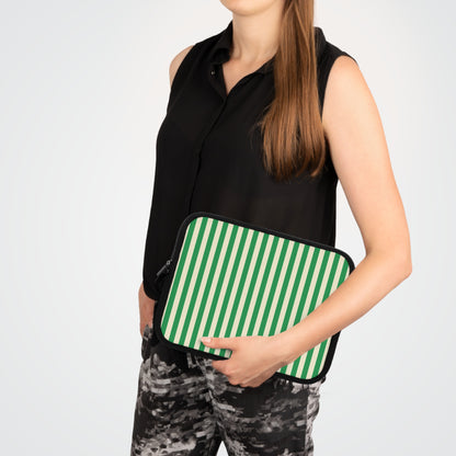 Woman carrying a Green Cream Cabana Stripe laptop sleeve