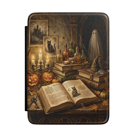 Haunted Library Kindle case front cover with pumpkins, candles and a ghost
