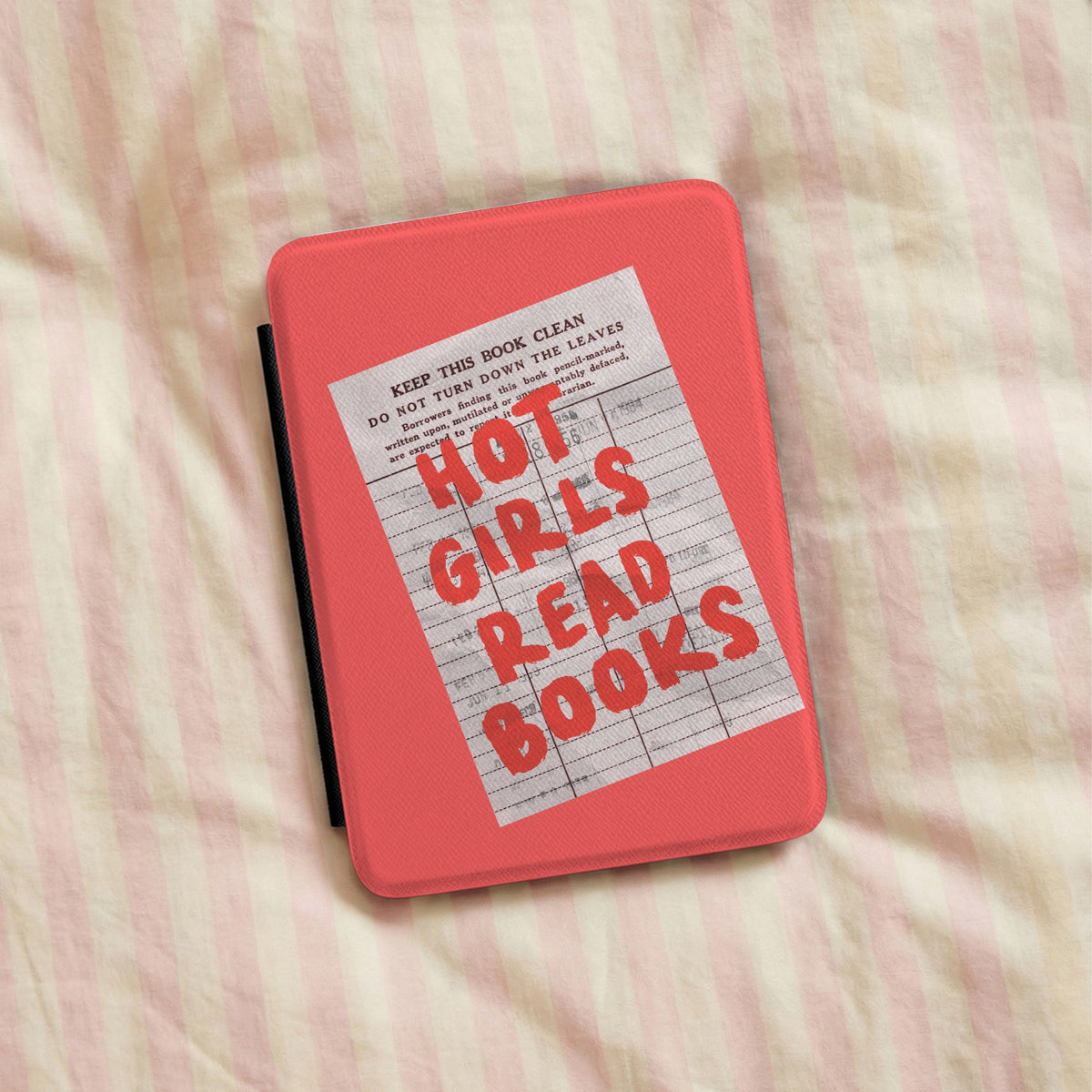 Hot Girls Read Books Kindle case lying on pink striped bedding