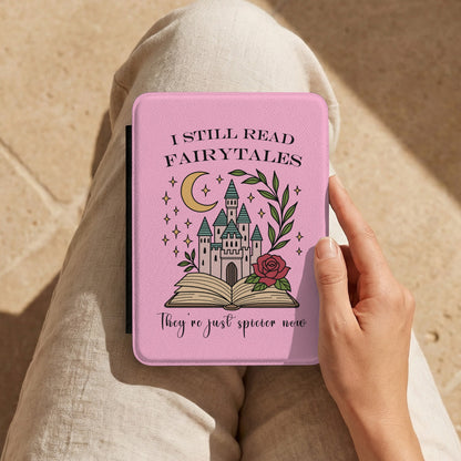 I Still Read Fairytales Kindle case held on the lap while reading