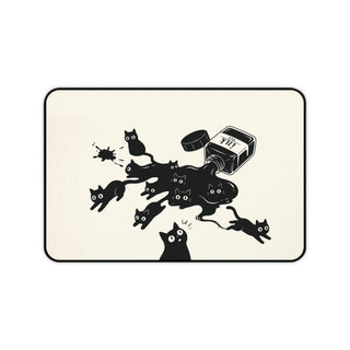 Ink Spill Cats desk mat laid flat showing black cats running from a tipped ink pot
