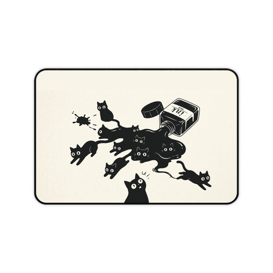 Ink Spill Cats desk mat laid flat showing black cats running from a tipped ink pot