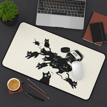 Ink Spill Cats desk mat from above with a keyboard and notebook
