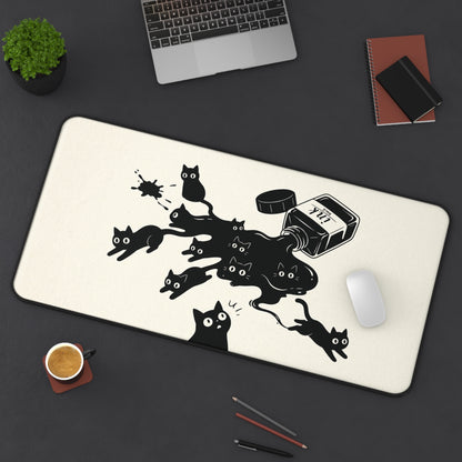 Ink Spill Cats desk mat in a wider size on a dark desk