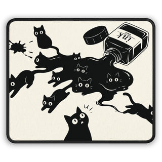 Ink Spill Cats mouse mat with black cats pouring from a tipped ink pot