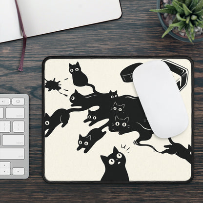 Ink Spill Cats mouse mat beside a keyboard with a white mouse