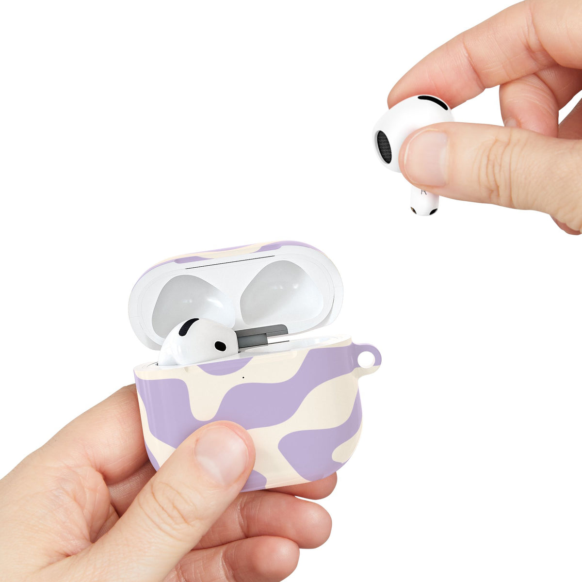 Lavender Swirl AirPods case held in hand with an AirPod