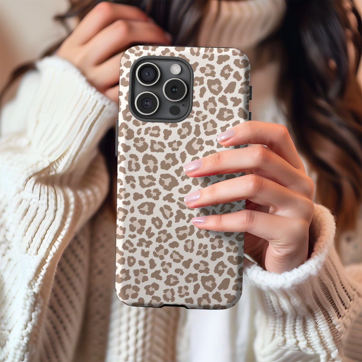 Woman holding a leopard print tough phone case