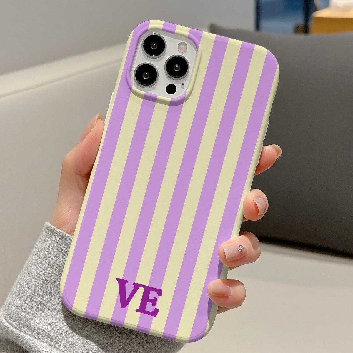 Lilac Cabana Stripe tough phone case with VE monogram held in hand