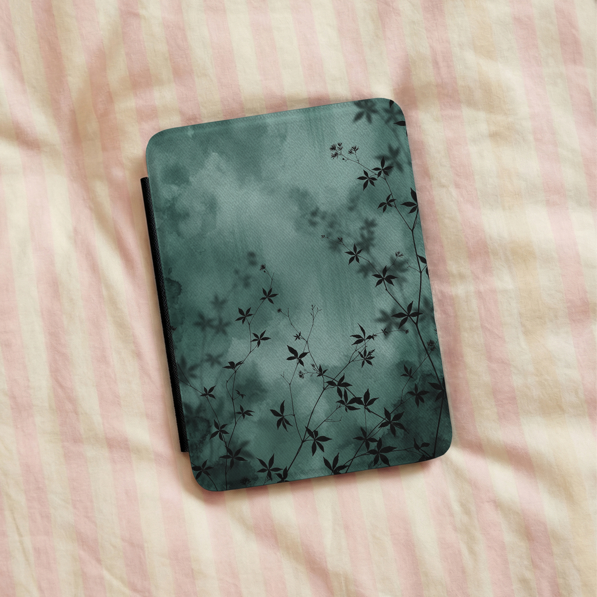 Midnight Garden Kindle case in a reading scene, moody green botanical print