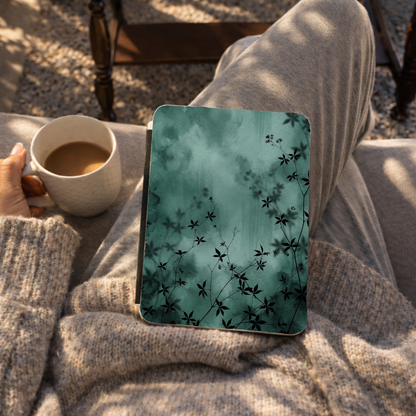 Midnight Garden Kindle case lifestyle photo with emerald watercolor plant shadows