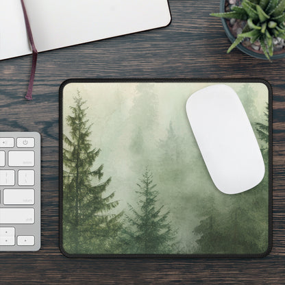 Misty Pine Forest mouse mat on a desk beside a keyboard and white mouse