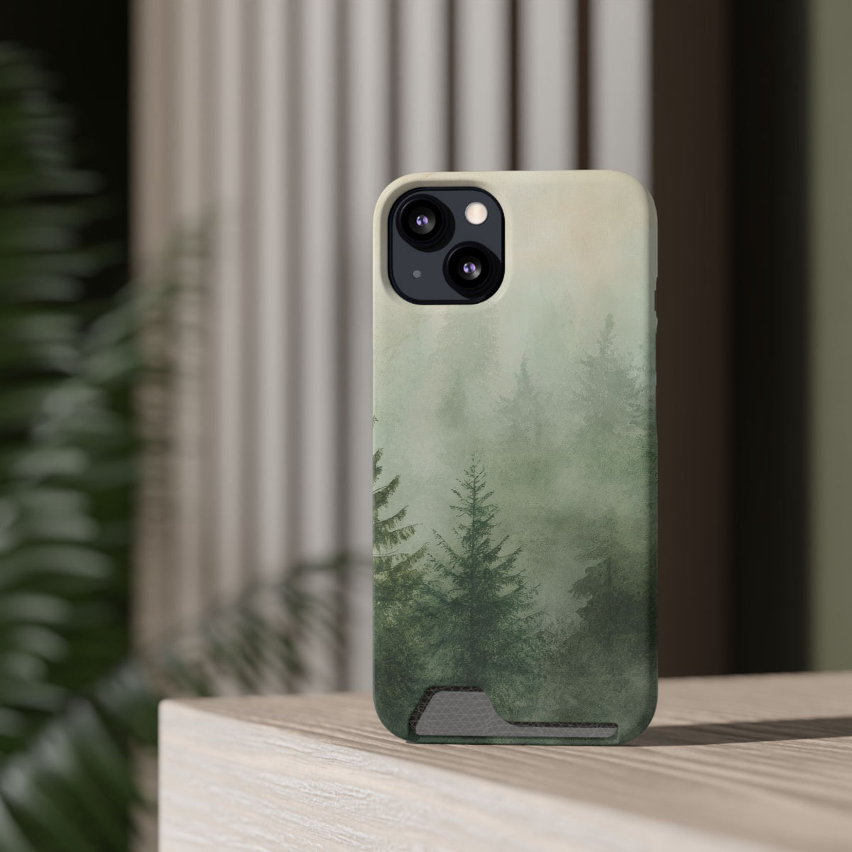 Misty Pine Forest card holder phone case on an iPhone standing on a shelf