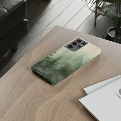 Misty Pine Forest card holder phone case lying on a wooden desk