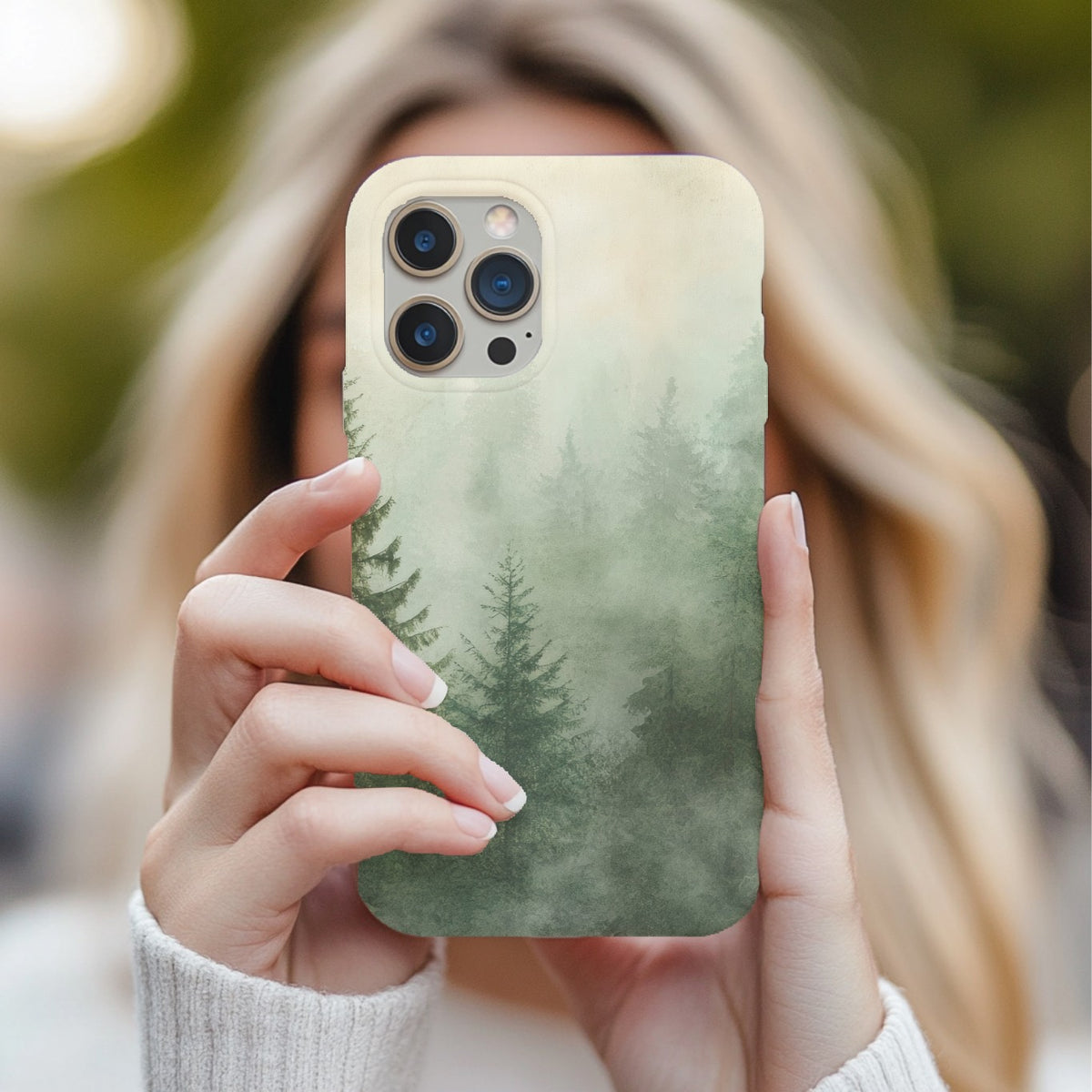 Misty Pine Forest tough phone case held up in front of a face