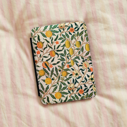 Morris Fruit Kindle case lying on pink striped bedding