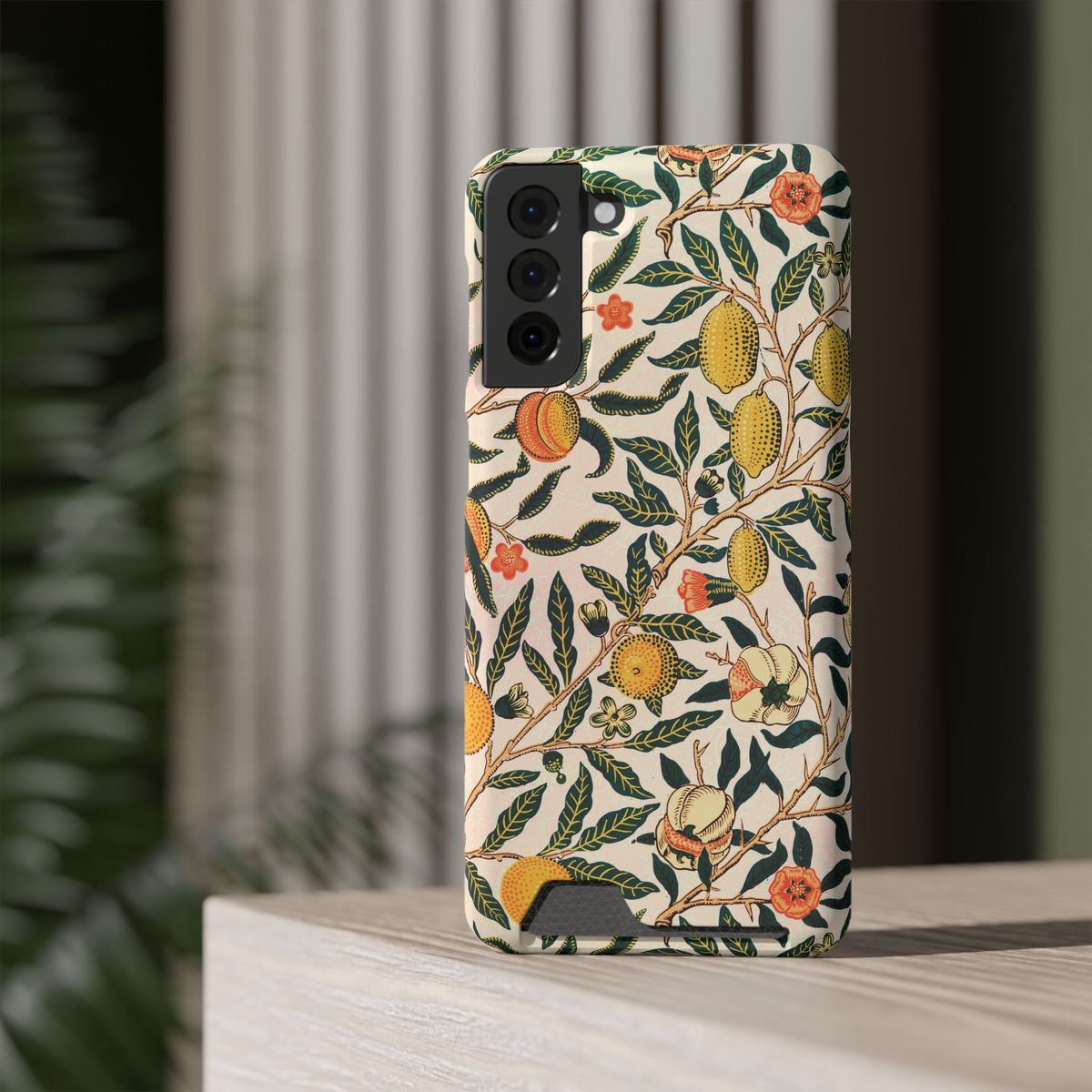 Morris Fruit card holder phone case on a Samsung Galaxy on a shelf