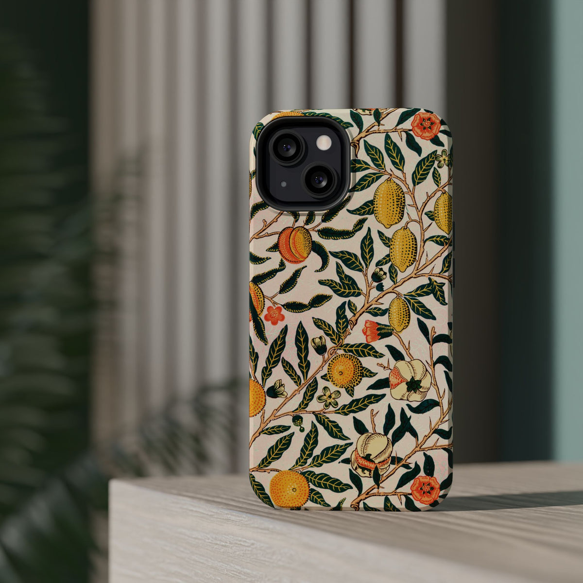 Morris Fruit MagSafe phone case standing on a shelf