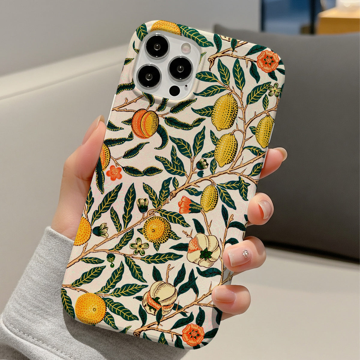 Morris Fruit tough phone case held in hand at a desk