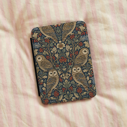 Morris Owls Kindle case on a striped bedspread
