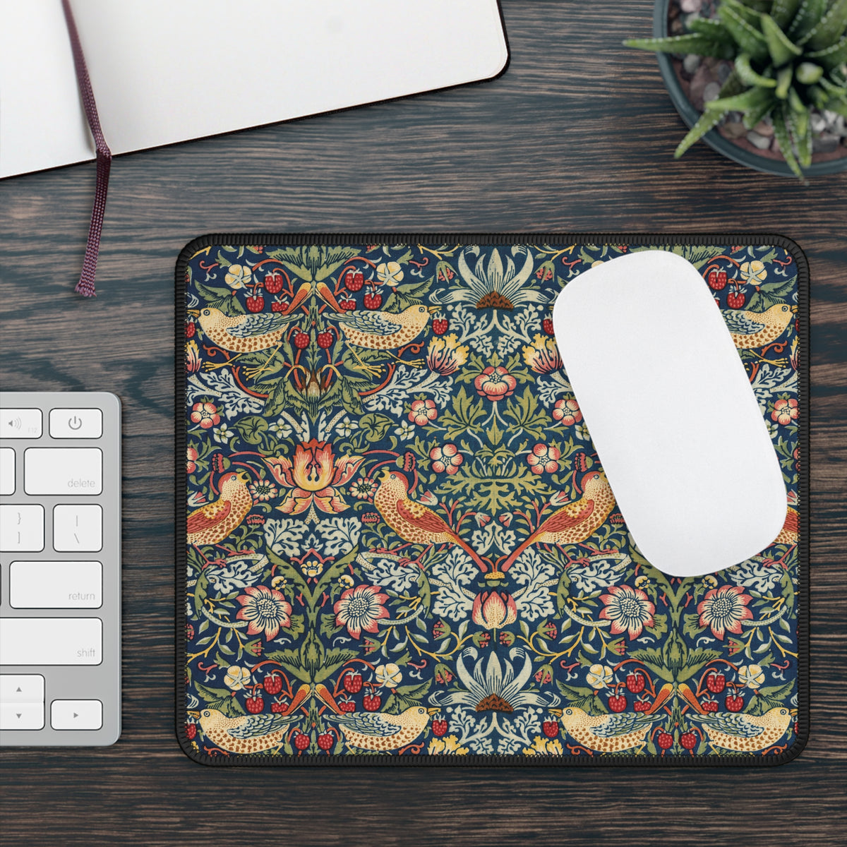 Morris Strawberry Thief mouse mat beside a keyboard with a white mouse